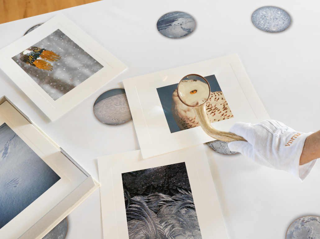 Vinter Clamshell Portfolio. Leather, pigmented ink fabric, book cloth. 9.5"w x 12"h x 2"d. 2015. Vinter Tablecloth. Pigmented ink on satin. 44" x 84". 2017. Magnifying lens 2. Deer antler. 12"h x 2.75"w x 1"d. 2017. Embroidered gloves. 2017. Embossed photographic prints. 8.5" x 11". 2017